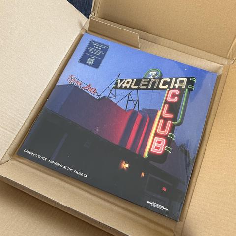 Unboxing picture of the album "Friday Night At The Valencia", front cover