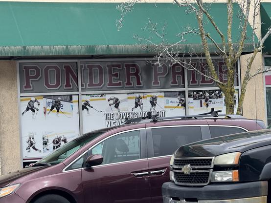 A store window at Sports Etc. in Arlington, MA says “PONDER PRIDE”