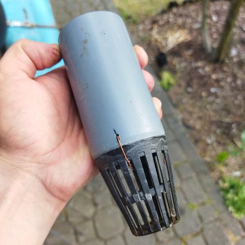 A net cup wired to a PVC pipe