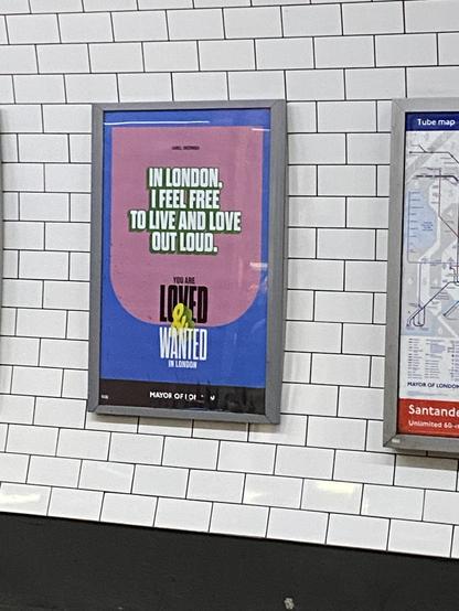 A photo of a poster mounted on a white tile wall. The poster has text that says "IN LONDON I FEEL FREE TO LIVE AND LOVE
OUT LOUD," and "you are loved and wanted in London"