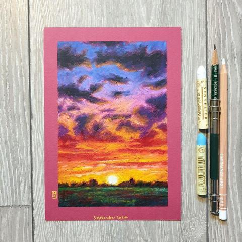 An oil pastel painting of a sky with clouds and a colourful sunset with orange red and blue violet tones.
an original art work
Fine art oil pastel on toned pastel paper
Size A5 (21cm x 14.5cm)
Sold unframed