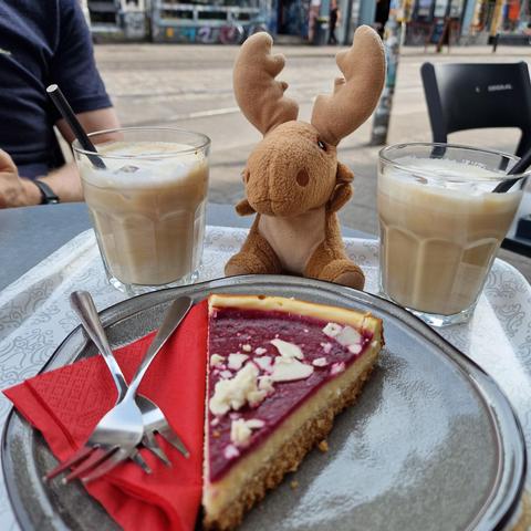 Iced cappuccino and cheese cake for afternoon snack at coffee corner