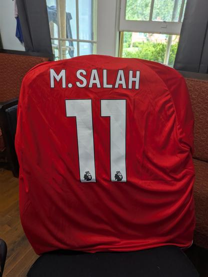 Back of Liverpool home jersey with M Salah and number 11