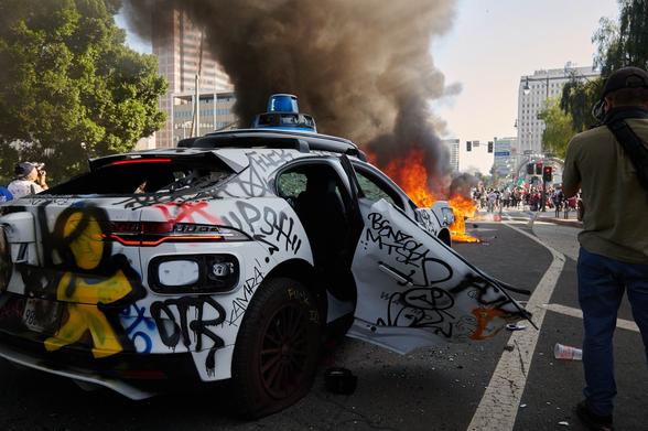 A Waymo vehicle set on fire in Los Angeles in June 2025.