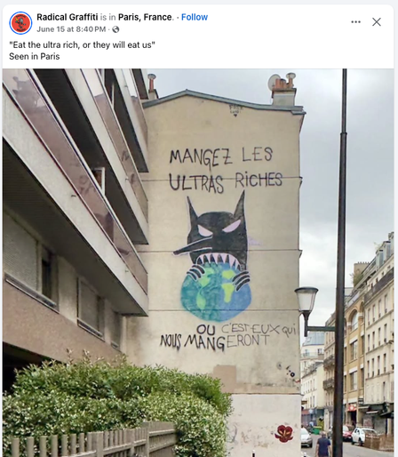 A very larger (3 story) graffito on the side of an apartment building in Paris with a black satyr with sharp teeth chomping down on the world and the text 'Mangez les ultra riches' and below it 'Ou [c'est eux qui] nous mang[erons]' — the text in brackets has been added later to correct the grammar of the original.