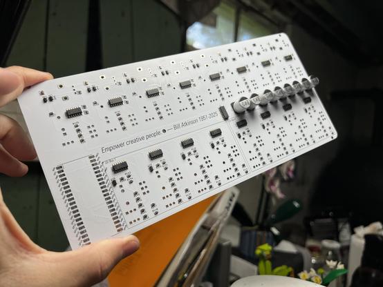 The back of the circuit board, showing its array of digital/analog converters, op amps, multiplexers, resistors, and some big honkin capacitors to keep the servos fed. 

A Raspberry Pi Pico2 will go in the bottom left there, communicating signals between the Palette and the plugdata patch running on a computer.