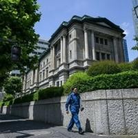 Bank of Japan holds rates, will slow bond purchase taper | National News