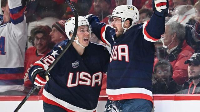 Dylan Larkin (right) and Matt Boldy celebrate Team USA's goal at the NHL Four Nations Face-Off game between the United States and Canada.