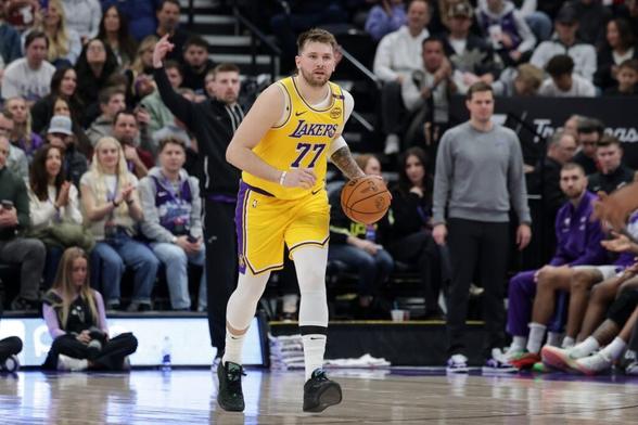 Feb 12, 2025; Salt Lake City, Utah, USA; Los Angeles Lakers guard Luka Doncic (77) dribbles during the second quarter against the Utah Jazz at Delta Center. Mandatory Credit: Chris Nicoll-Imagn Images