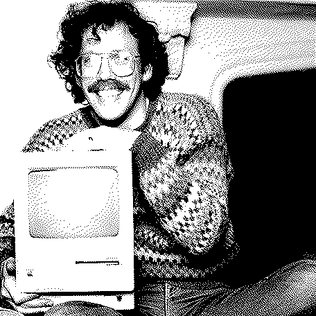 A photo of Bill Atkinson posing with an early Macintosh.  Image is dithered with the Atkinson dithering algorithm.