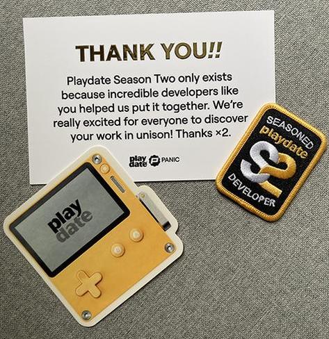 Photo I took of the adorable little bit of mail Panic sent me, thanking the Season 2 Playdate developers for their participation! It includes a sticker of a Playdate and a lovely little embroidered patch.