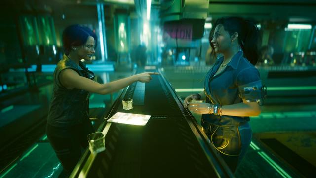 Cyberpunk 2077 screenshot player character pointing and smiling at Claire across the bar.