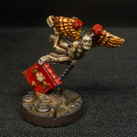 a gross little robotic baby cherub angel with dead pallid flesh dragging an enormous tome on chains