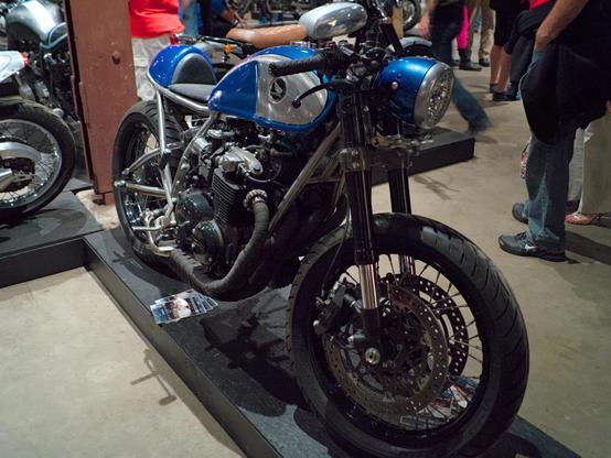 A silver and blue motorcycle that was custom built