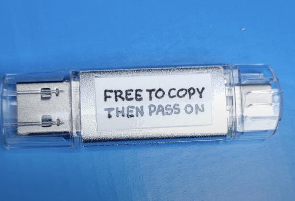 An unmarked USB flash drive with a label reading "FREE TO COPY THEN PASS ON" against a blue background.

the deaddrop idea: https://deaddrops.com

pic found at: https://www.reddit.com/r/de_EDV/s/GN6YebYhC8