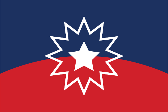 The Juneteenth flag: a convex red field on the bottom and a concave blue field on top with a five-pointed white star surrounded by a multi-pointed star outline between them. Source: Wikipedia.