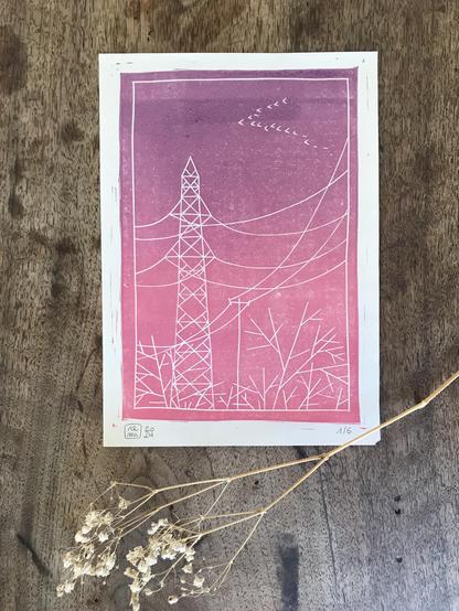 Linocut print of an electric pole and some trees. The picture is printed in a gradient of purple to pink inks.