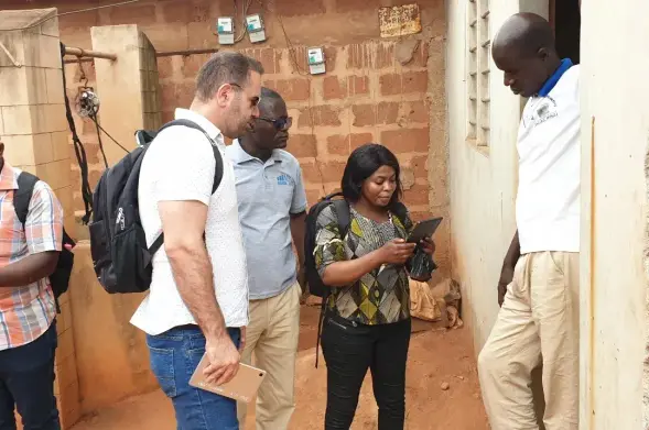 Photograph of census fieldwork with the National Institute of Statistics and Demography (INSTaD), Fieldwork, Abomey Calavi, Benin. 