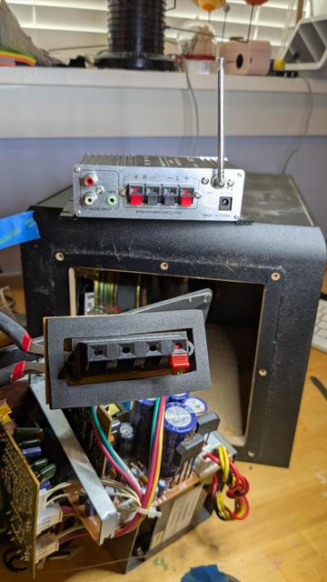 A broken speaker terminal, sitting in front of a potential donor