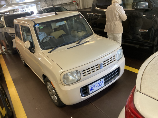 A tiny crossover is parked in a vehicle ferry.