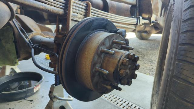 Closeup of the 2007 GMC Sierra's rear brakes. They're not *terrible*, but it makes sense to replace them while we have everything easily accessible.