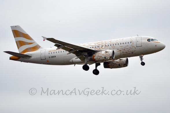 Side view of a twin engined jet airliner flying from left to right at a very low altitude, with flaps extended from the rear of the wing and undercarriage lowered, suggesting it is about to land.
The plane is mostly white, with gold lines on the forward fuselage and engines suggesting a feathered body.
There are 3 wavy gold stripes on the tail, gold "British Airways" titles on the upper rear fuselage, and the black registration "G-DBCB" on the lower rear.
Grey cloud fills the rest of the frame.