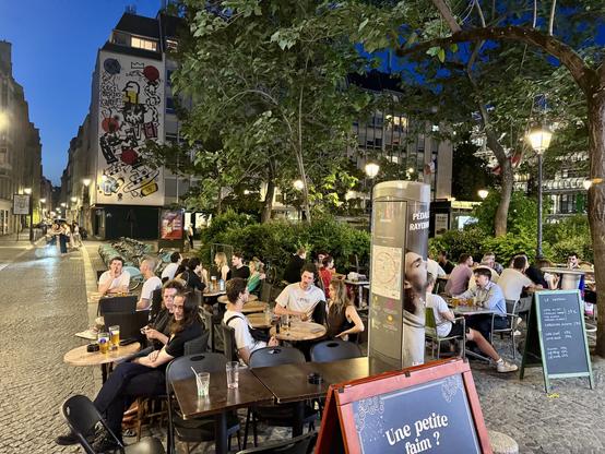 BIG street patio filled with people