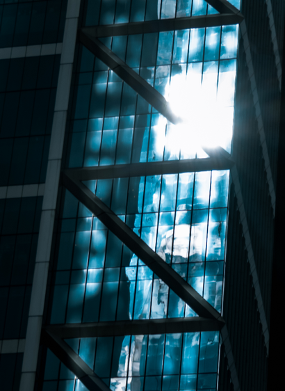 A closeup of sunlight reflecting off the glass of a skyscraper
