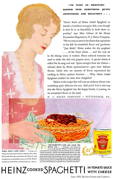 A young woman carries a warm steaming clear pot of pasta with a pot roast in the middle of the pasta. There appears to be red sauce across the top.