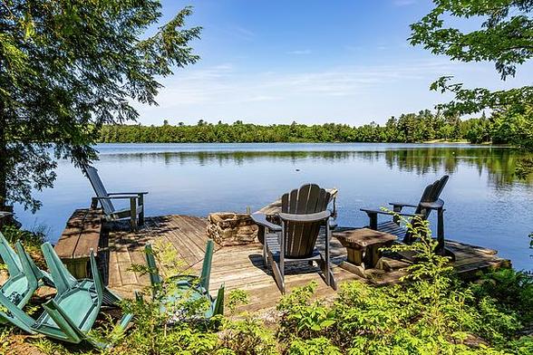 Enjoy the serenity of Solitaire Lake in Muskoka, Ontario, with picturesque views and a tranquil atmosphere perfect for relaxation.