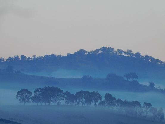 Hills to our west wreathed in fog