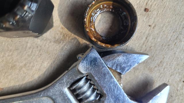 Absolutely filthy bottom bracket crank ring. But no longer rusty