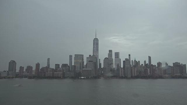 This webcam usually shows a view of the New York skyline with the World Trade Center skyscraper showing prominently. It's a rainy day. It's 75ºF/24ºC.