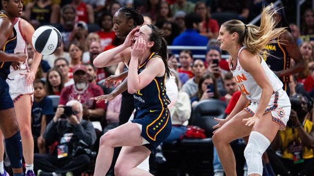 Caitlin Clark gets knocked down by Marina Mabrey. Chris Evert reacts