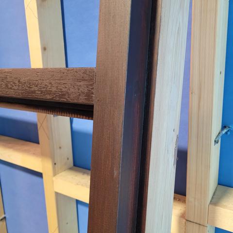 A close up view of a portion of the window frame.