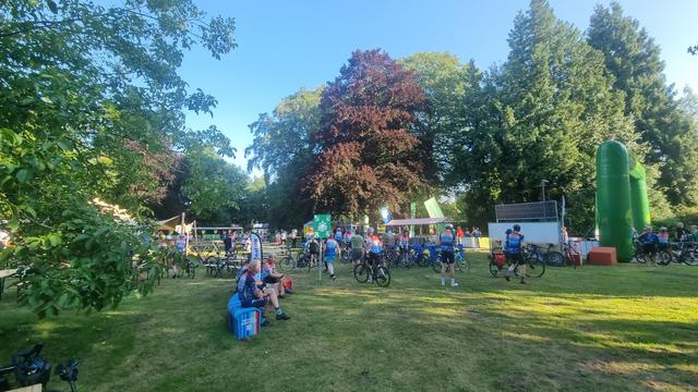 Cyclists in climate stripes shirts gathering in park