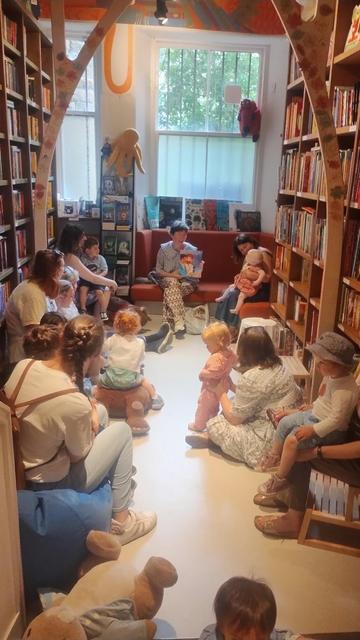 Looking into the Children's Room of the Edinburgh Bookshop as author Rachel Plummer reads from her book about two gay giants being married, The Big Day, for a special Pride Month edition of the Under Fives Storytime