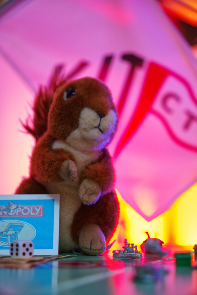 The KITCTF mascot in front of a monopoly game.