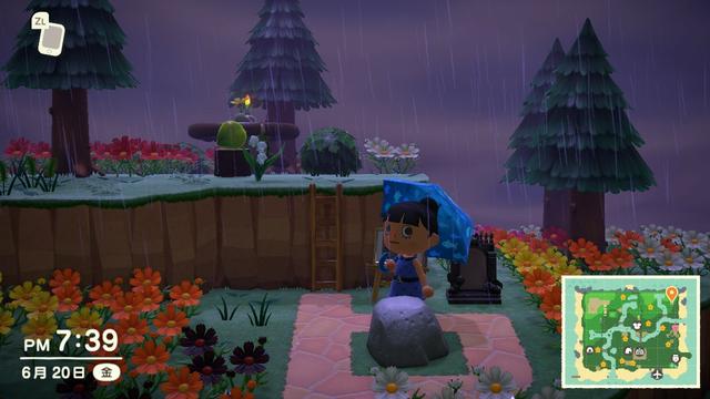 「あつまれ どうぶつの森」のスクリーンショット。ゲーム内で雨が降っている