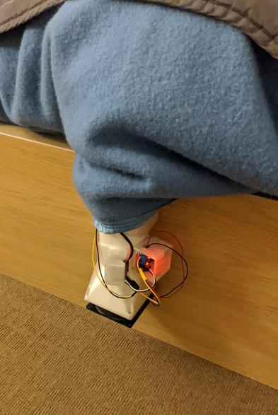 pipe with electronics sticking out from the end of my bed