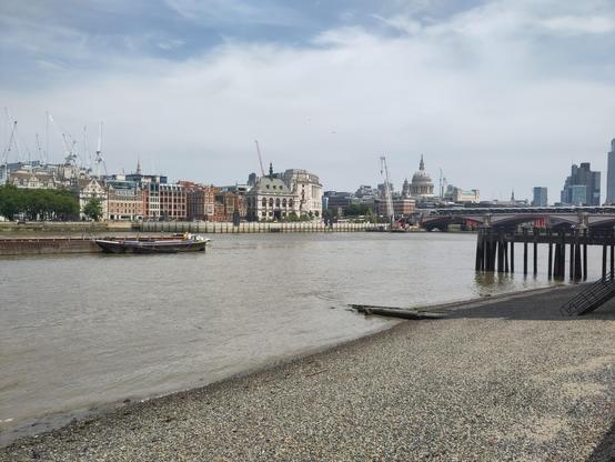 The river Thames, looking back towards Blackfriars Bridge. The dome of St Paul's is prominent on the skyline.