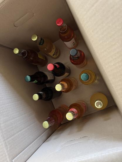 Inside of a cardboard box with 13 bottles of (supposedly) premium British Cider.