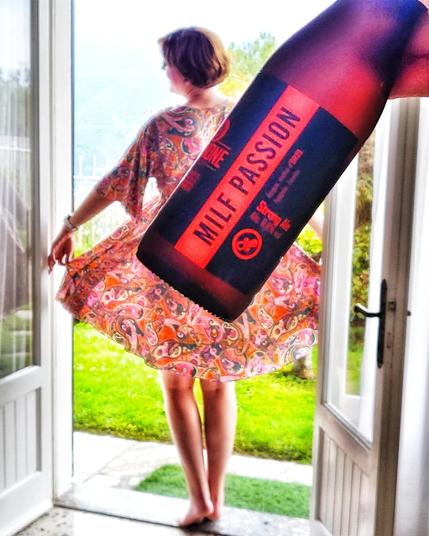 woman in dress with milf passion craft beer bottle