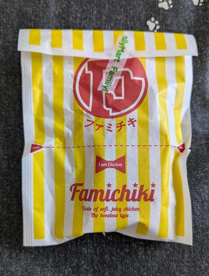 A piece of Famichiki in its Famichiki bag.