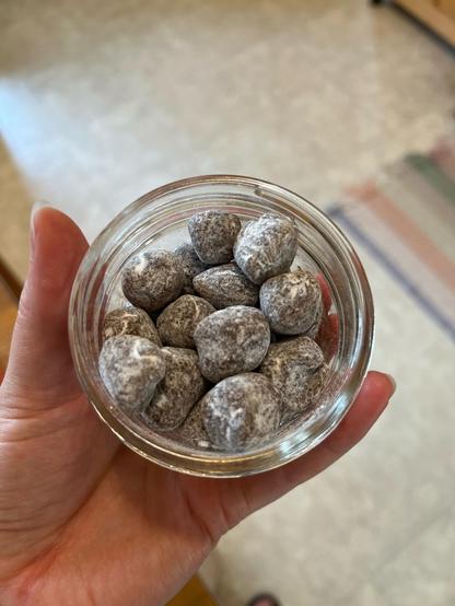 Finished lozenges, irregular round shapes with a light coating of starch left over from the powdered sugar after shaking off the excess. They’re in a wee 4oz canning jar and destined for my work desk.