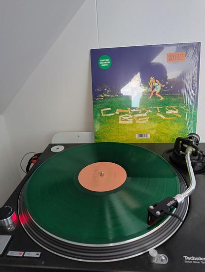 Photo of a turntable playing the album Chastity Belt by the band Chastity Belt.