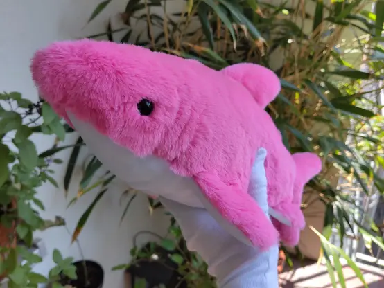 Front of the shark plushie showing the different long fur fabrics.