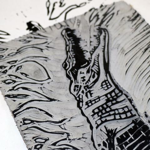 linocut of a crocodile