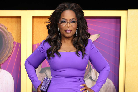 Oprah Winfrey looking beautiful in a purple gown