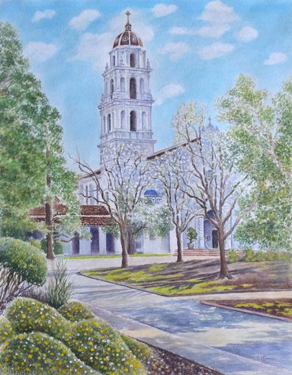 Watercolor painting of the chapel at Saint Mary's College of California. There are trees and plants, with a walkway leading to the chapel. Blue sky with a few clouds, a few blossoms showing early spring.